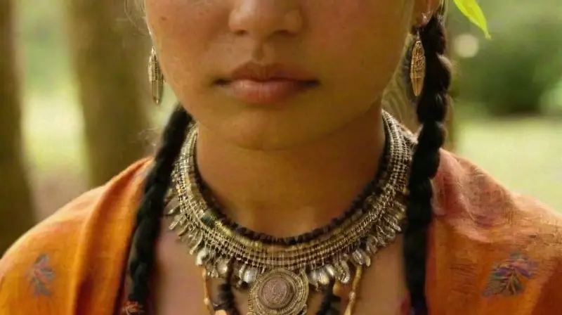 Young tribe member undergoing a ceremonial piercing