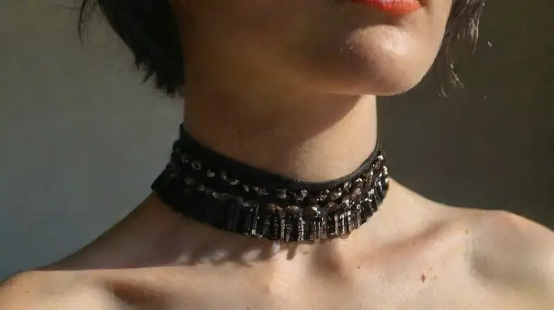 Close-up of pierced neck and upper chest