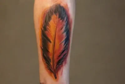 Detailed fiery phoenix tattoo on forearm