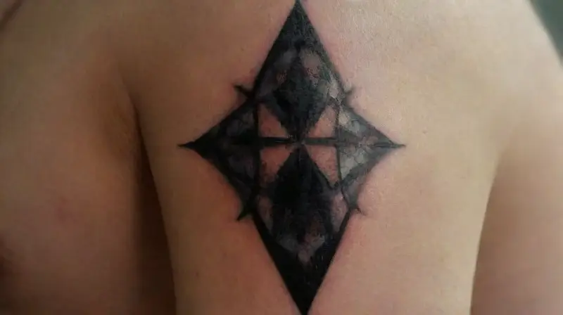 Detailed tattoo and piercing on shoulder
