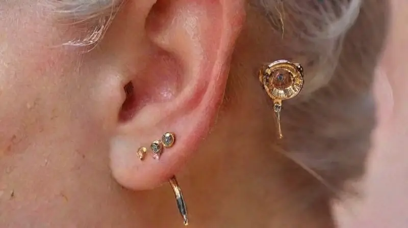 Detailed watercolor portrait of pierced ear