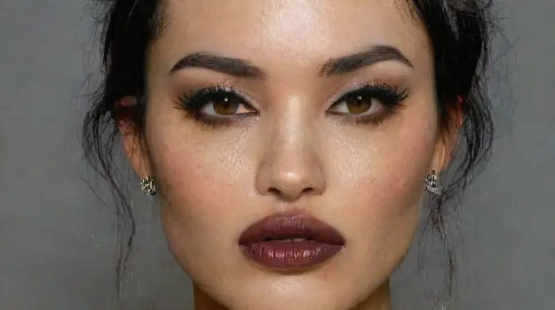 Gothic woman with tattoos and intense gaze