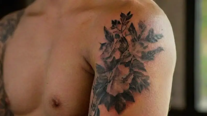 Person displays detailed full sleeve tattoo