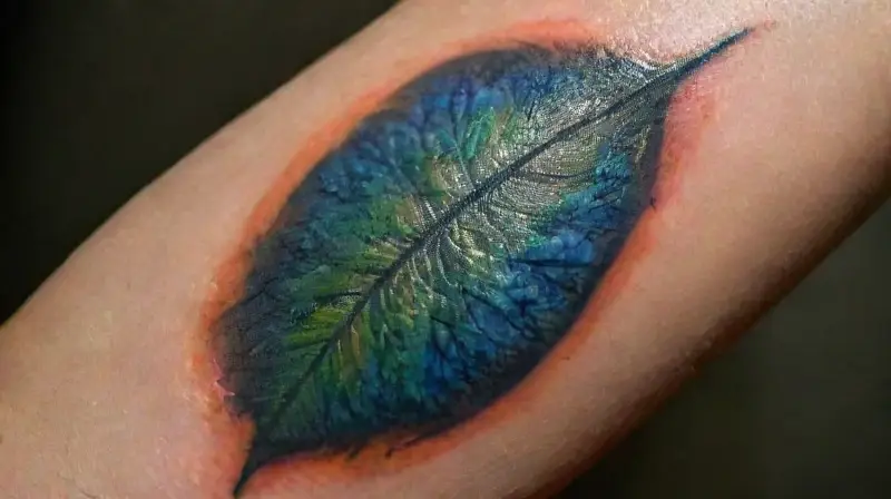 Close-up of detailed, colorful tattooed forearm